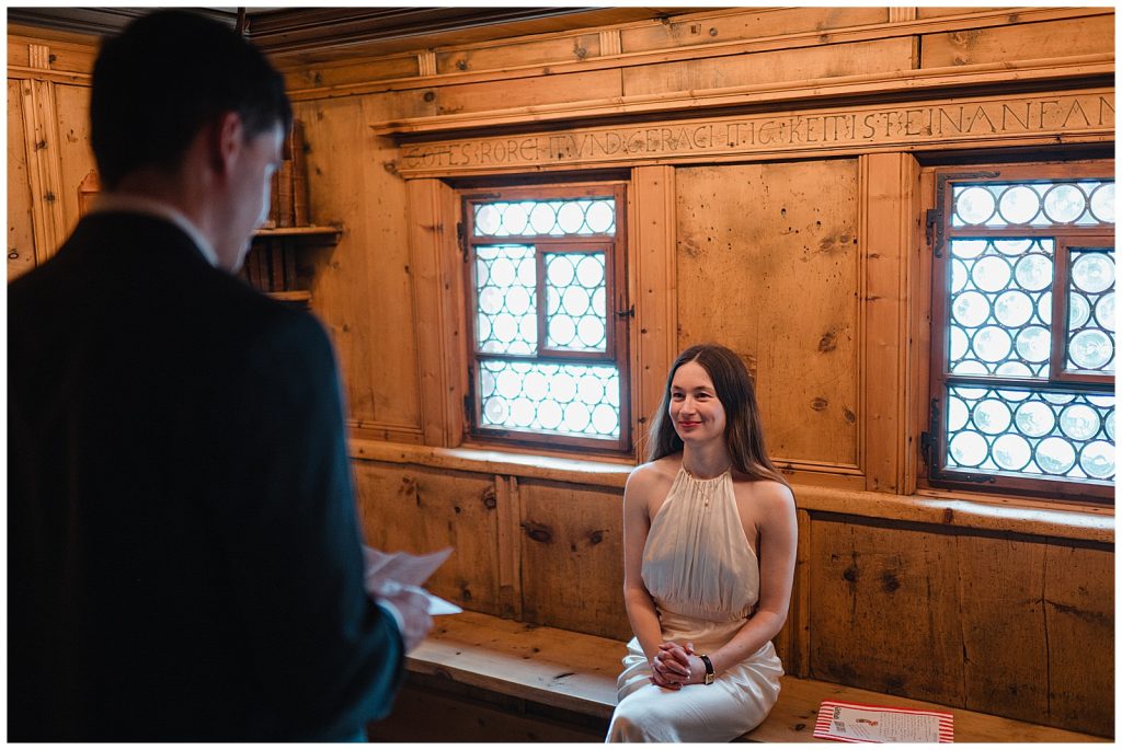 Candid family portrait of bride groom and daughter in Klosters